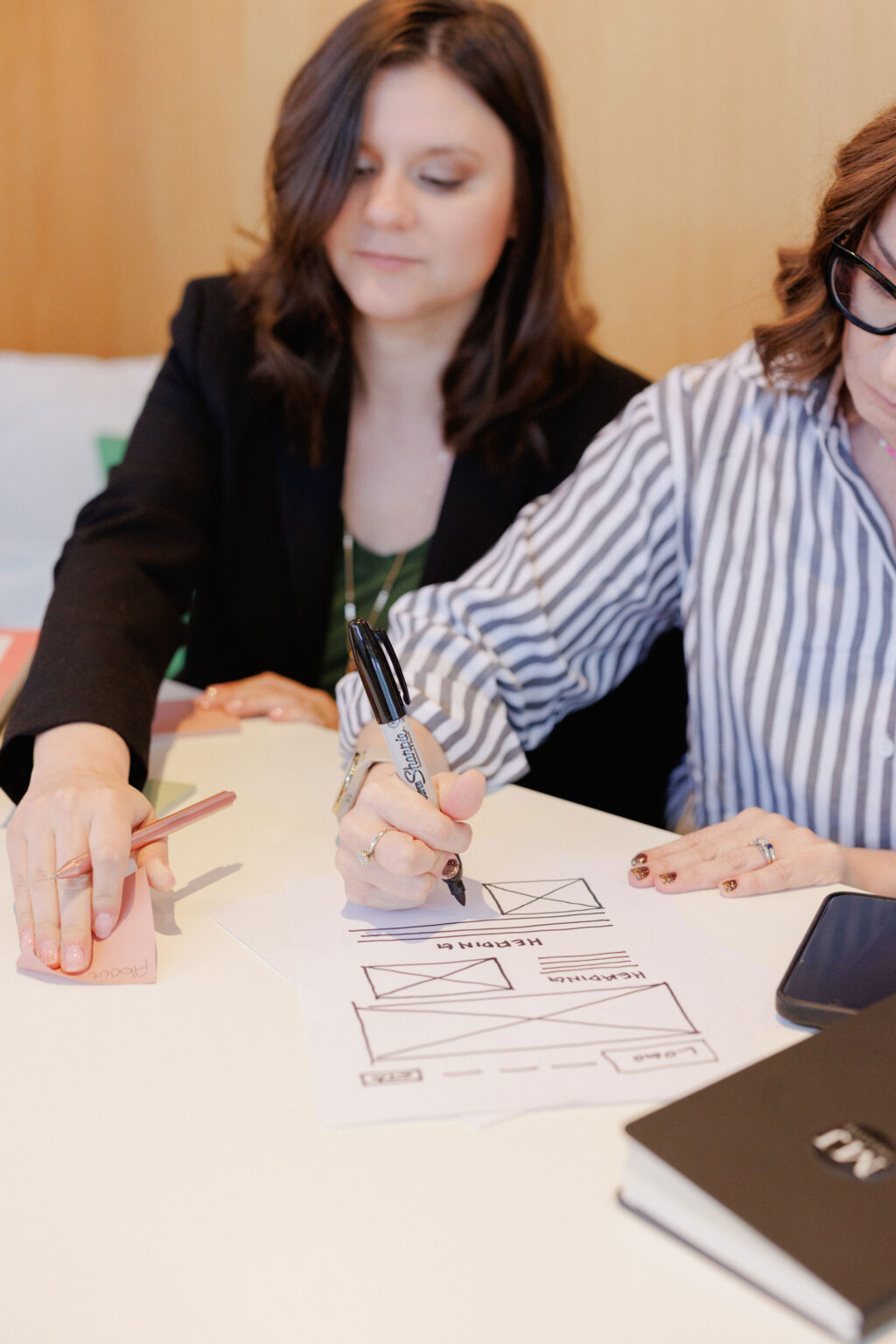 Charlotte web designer drawing a site map with sharpie
